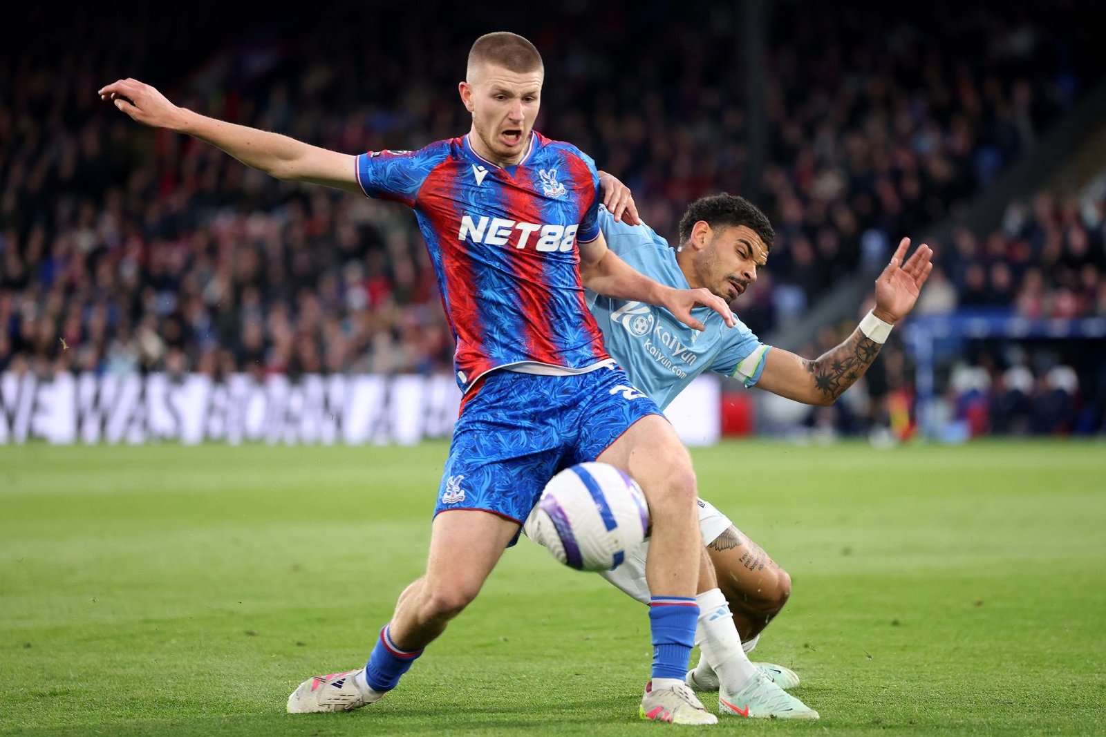 LONDON, ENGLAND - MAY 05: Adam Wharton of Crystal Palace battles for possession with Morgan Gibbs-White of Nottingham Forest during the Premier League match between Crystal Palace FC and Nottingham Forest FC at Selhurst Park on May 05, 2025 in London, England.