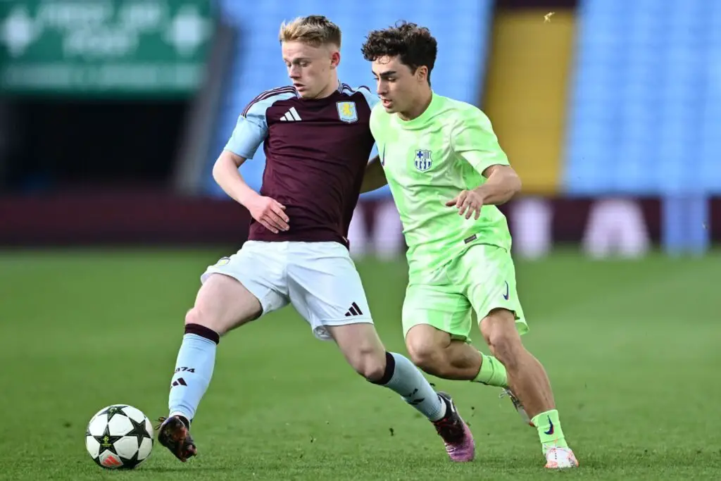 BIRMINGHAM, ENGLAND - MARCH 04: Aidan Borland of Aston Villa controls the ball under pressure from Jan Virgili of FC Barcelona during the UEFA Youth League Round of 16 match at Villa Park on March 04, 2025 in Birmingham, England.