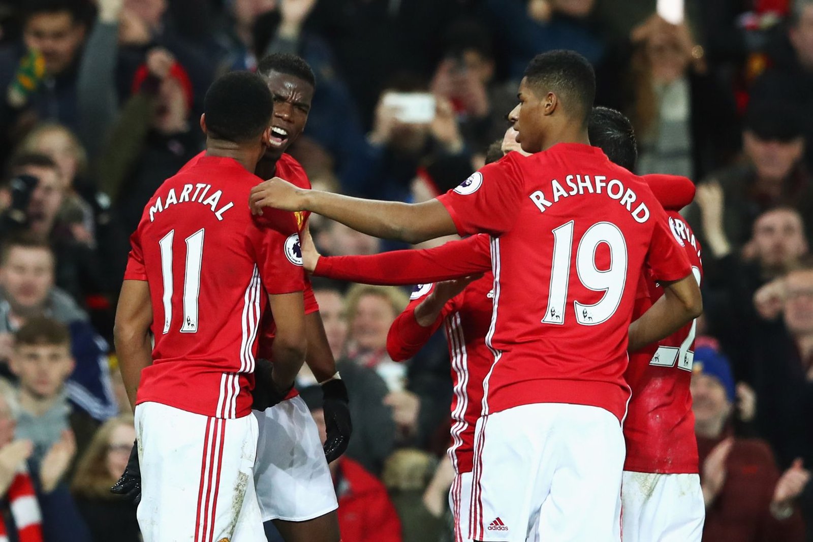MANCHESTER, ENGLAND - DECEMBER 31: Paul Pogba of Manchester United celebrates scoring his teams second goal of the game with team mates Anthony Martial and Marcus Rashford during the Premier League match between Manchester United and Middlesbrough at Old Trafford on December 31, 2016 in Manchester, England. 
