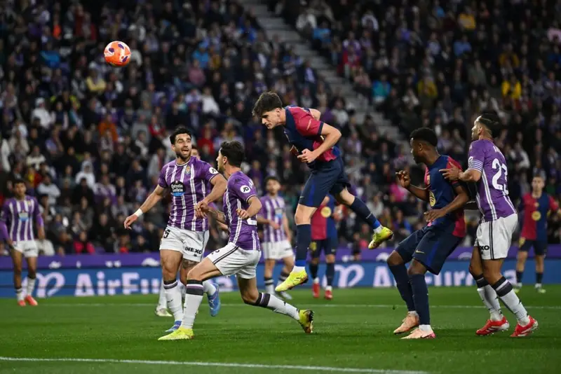 VALLADOLID, SPAIN - MAY 03: Pau Victor of FC Barcelona wins a header whilst under pressure from Antonio Candela of Real Valladolid CF during the LaLiga match between Real Valladolid CF and FC Barcelona at Jose Zorrilla on May 03, 2025 in Valladolid, Spain.
