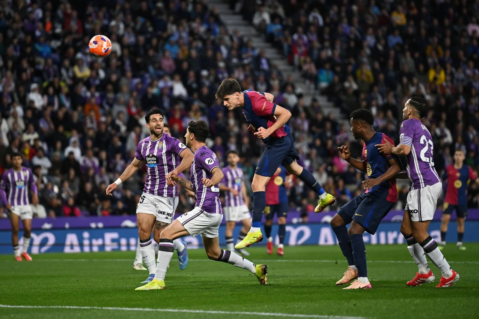 VALLADOLID, SPAIN - MAY 03: Pau Victor of FC Barcelona wins a header whilst under pressure from Antonio Candela of Real Valladolid CF during the LaLiga match between Real Valladolid CF and FC Barcelona at Jose Zorrilla on May 03, 2025 in Valladolid, Spain.