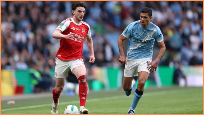 LONDON, ENGLAND - MARCH 22: Declan Rice of Arsenal takes on Rodri of Manchester City during the Carabao Cup Final match Arsenal and between Manchester City at Wembley Stadium on March 22, 2026 in London, England.
